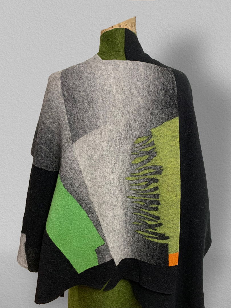 My jackets provide a broad canvas within which to play with light . The fabrics composing the jacket are knitted   dyed   then cut to form .re-felting them together into one piece of fabric   i then sew the sleeves on to arrive at the complete result .