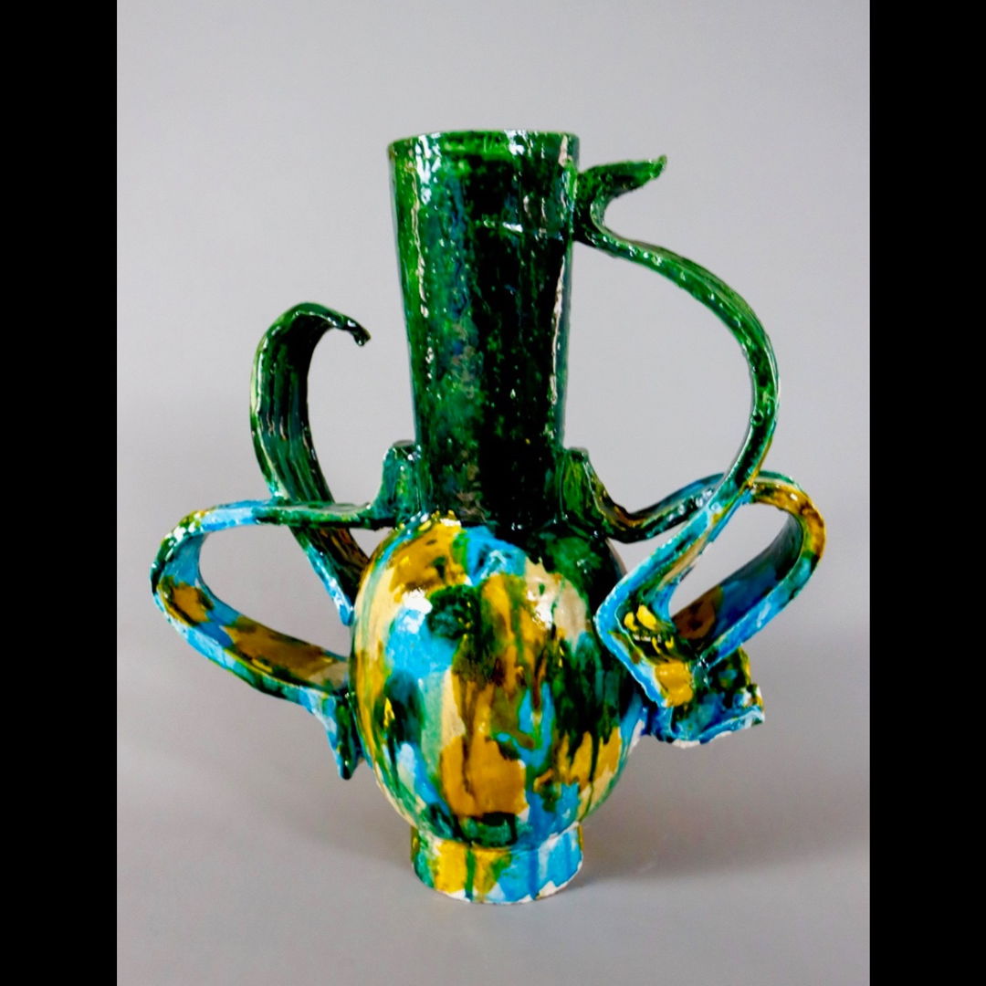 Handformed earthenware sculptural vessel created using a series’ of slumped forms parts of which are manipulated assembled and multifired glazing for one of a kind artworks