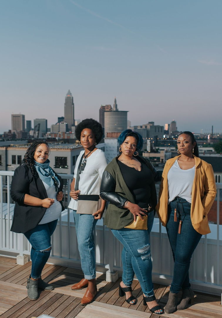 The models are wearing our tri-pocket cardigans  paired with our minimal crossbody bags and triangle scarf.
