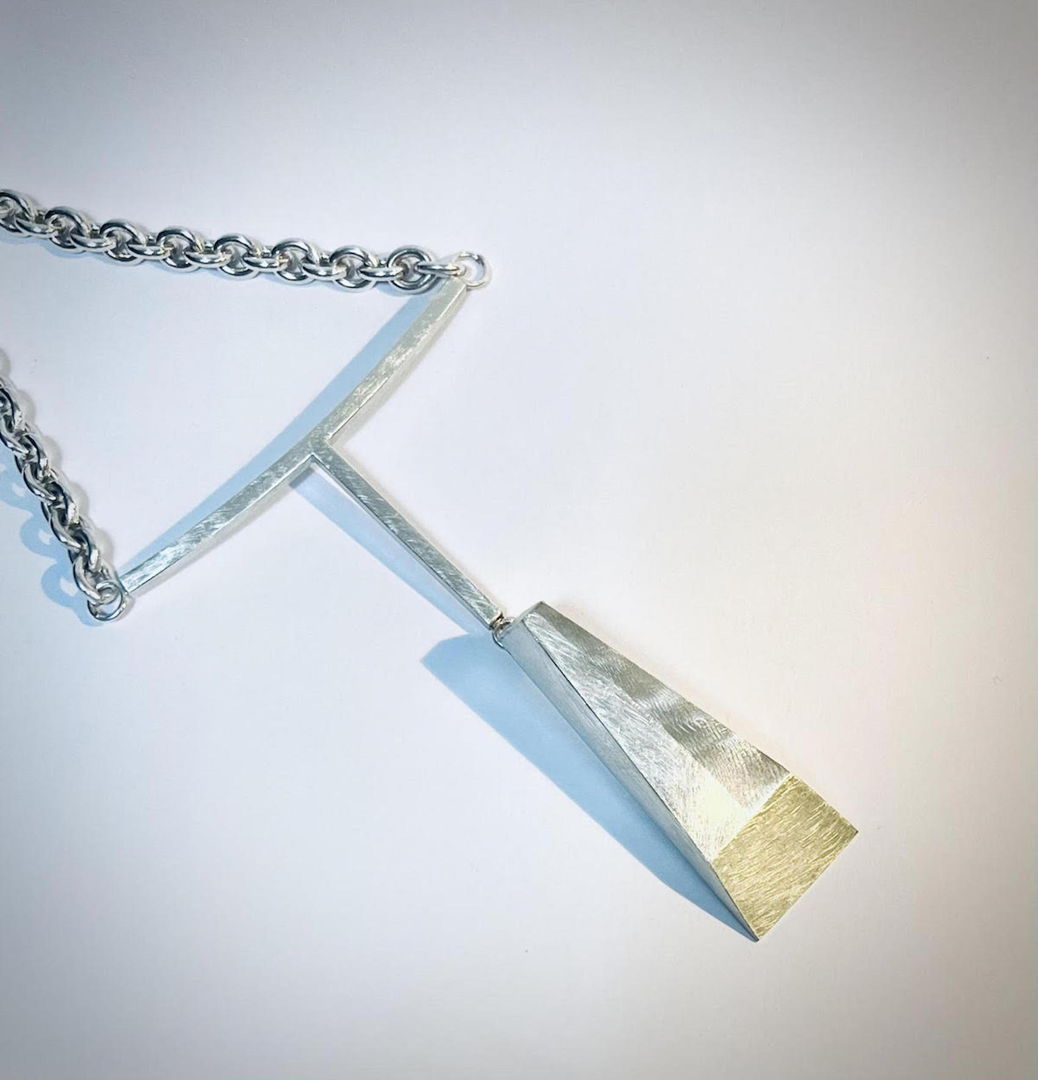 Hollow-formed and hand-fabricated from sterling silver and 18kt gold bimetal. Textural surface treatment. One of a kind.