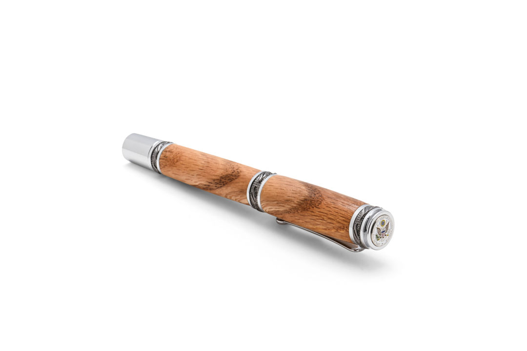 Writing instrument made of reclaimed oak that grew on the grounds of the Supreme Court for 110 years. Made for the Supreme Court Historical Society