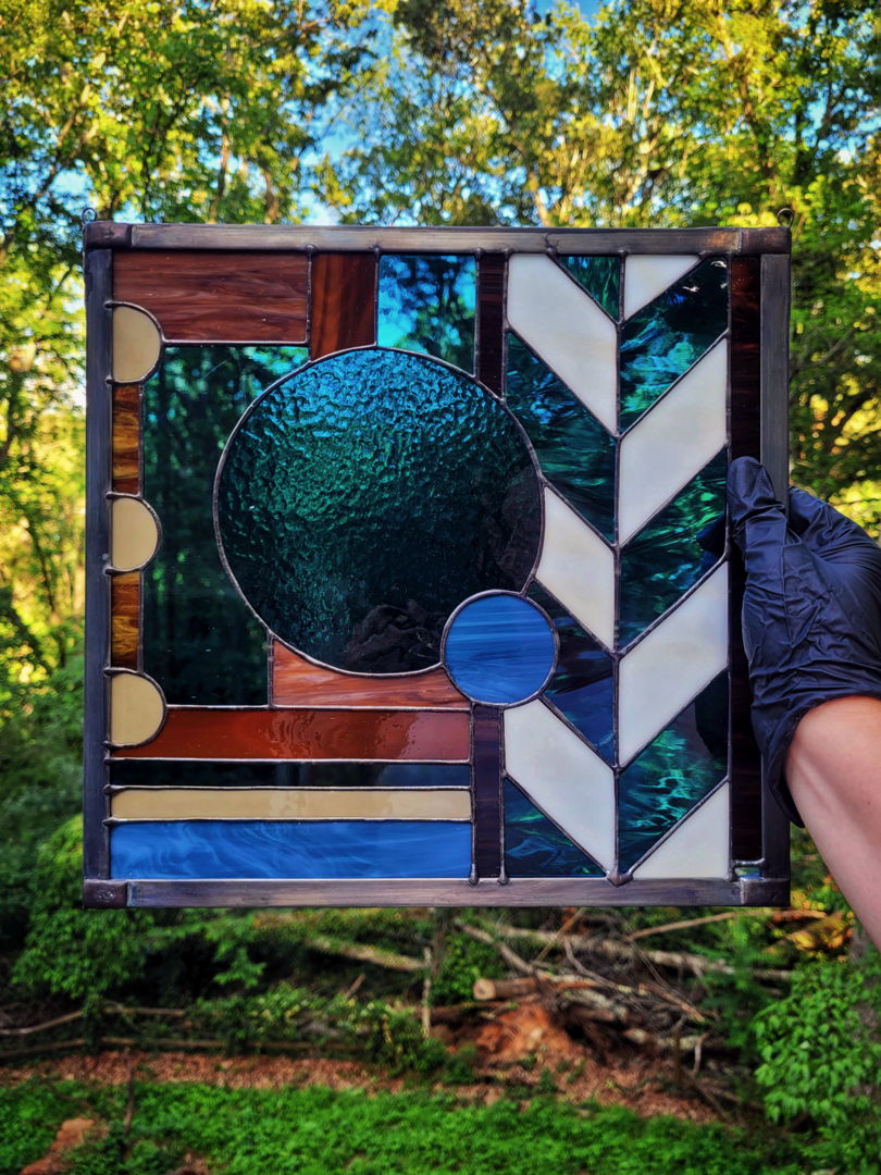 Handcrafted Art Deco abstract  driftwood palette  traditional copper foil method  framed in zinc