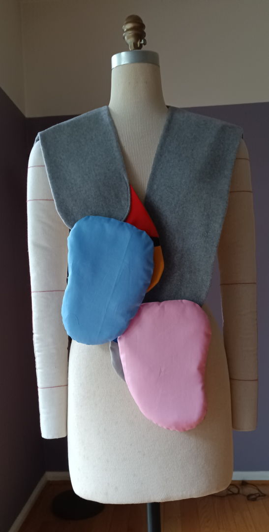 The Anivo Anatomical QUILTED Display Vest is where fashion and storytelling converge. Handcrafted from fine wool and cotton fabrics  it features carefully QUILTED layers beneath wool panels  accented with sculpted  puffy forms that recall abstract anatomy. Every stitch is a testament to craftsmanship  making it a timeless addition for those who value meaning in design. Step into Anivo and wear your imagination.