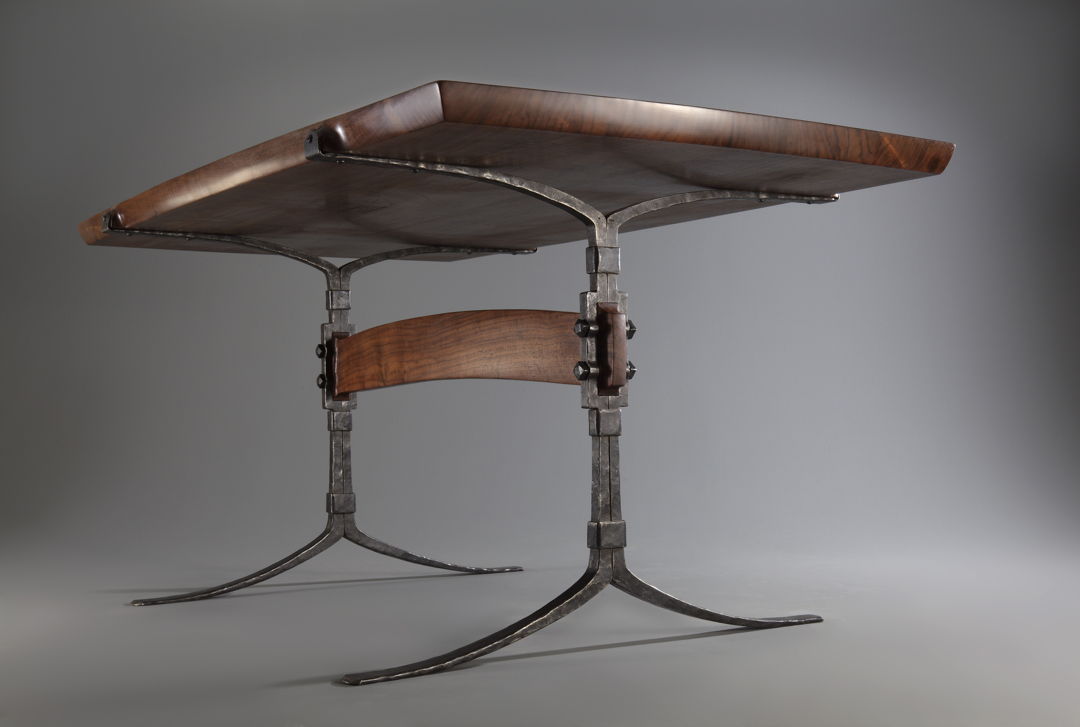 table with forged iron legs and wood top