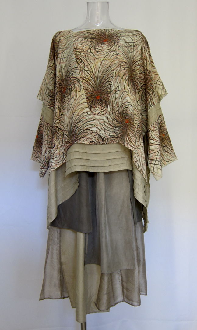 This pullover is made from 100% Monkinsha silk (no longer produced). The lining is dyed with rose natural dyes  and is also part of the design. The skirt is made from 100% silk fabric from different regions  dyed with rose natural dyes. The silk fabrics from different regions are each dyed a diffe