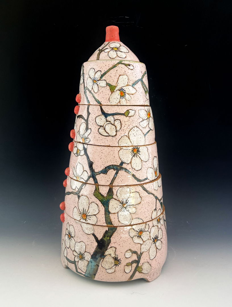 Jar made with a combination of hand-building and wheel-throwing techniques with painterly glaze and under glaze decoration of spring blossoms.