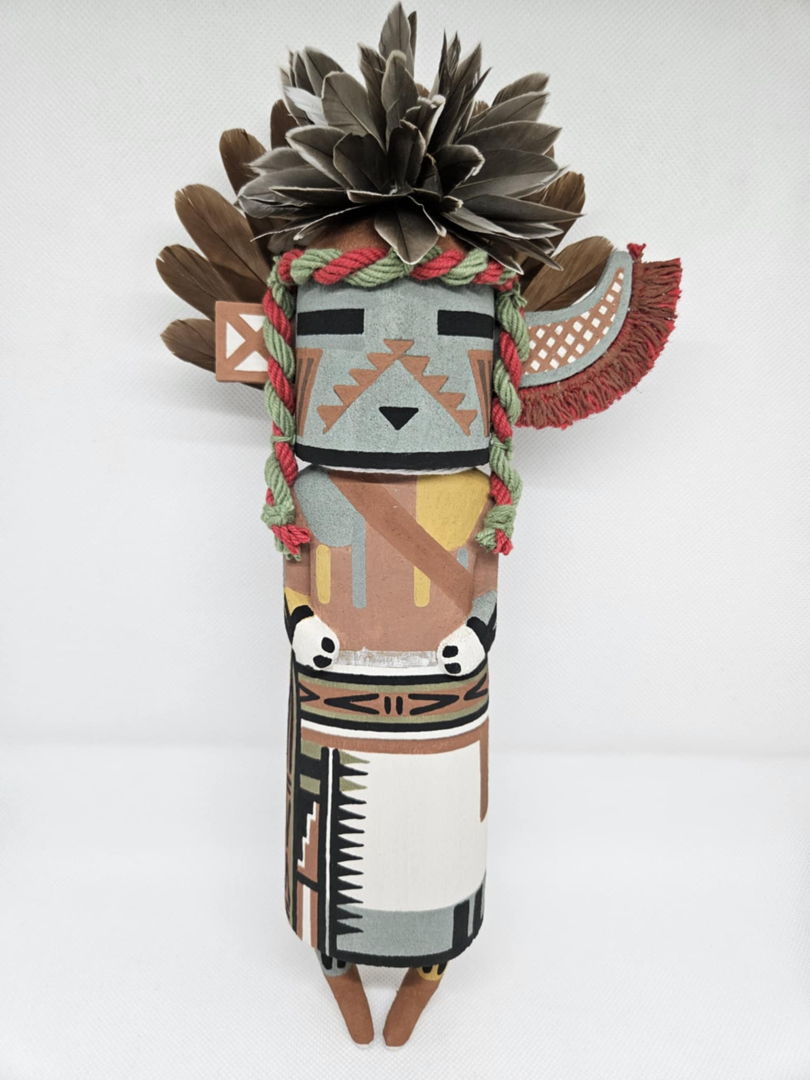 The Supai Kachina is a representation of the Havasupai tribe  he is often seen during the winter night and summer day dances. The Supai kachina is carved out of aged dried cottonwood root  painted with natural earth mineral paints that i hand collect and process myself. Duck feathers  partridge feathers and natural colored dyed yarn is used to complete the Supai Kachina.
