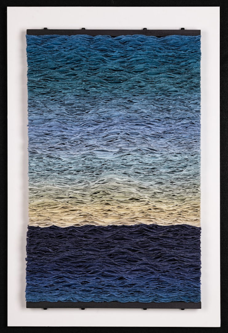 Continuous gradation of paper handmade by artist from pigmented abaca and linen pulp.