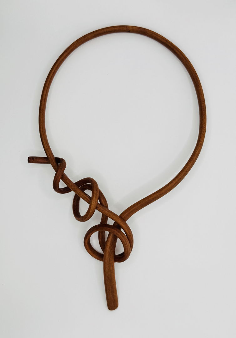 Steam-bent  self-latching choker