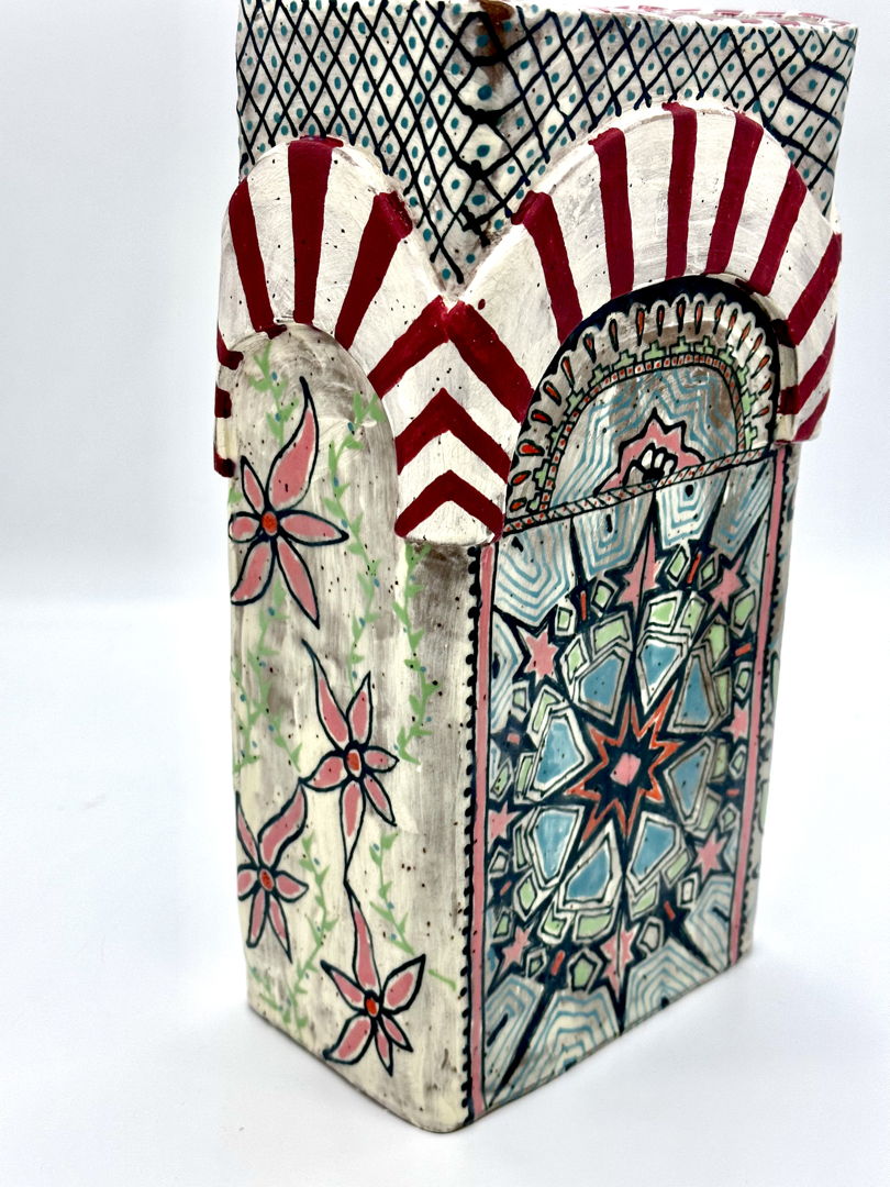 Hand built vase  depicting a 3-D archway which is inspired by the Grand Mezquita Cordoba.