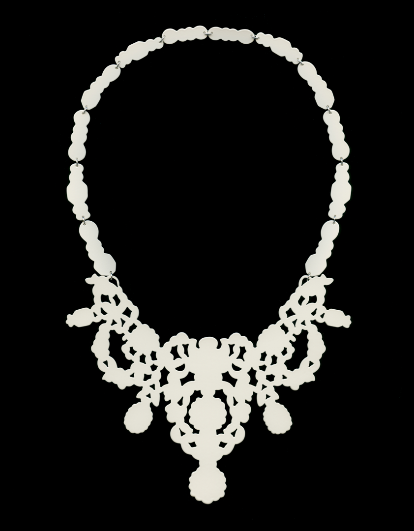 Necklace hand-pierced from 20g brass then powder coated cream. Necklace design inspired by images found in historical jewelry.