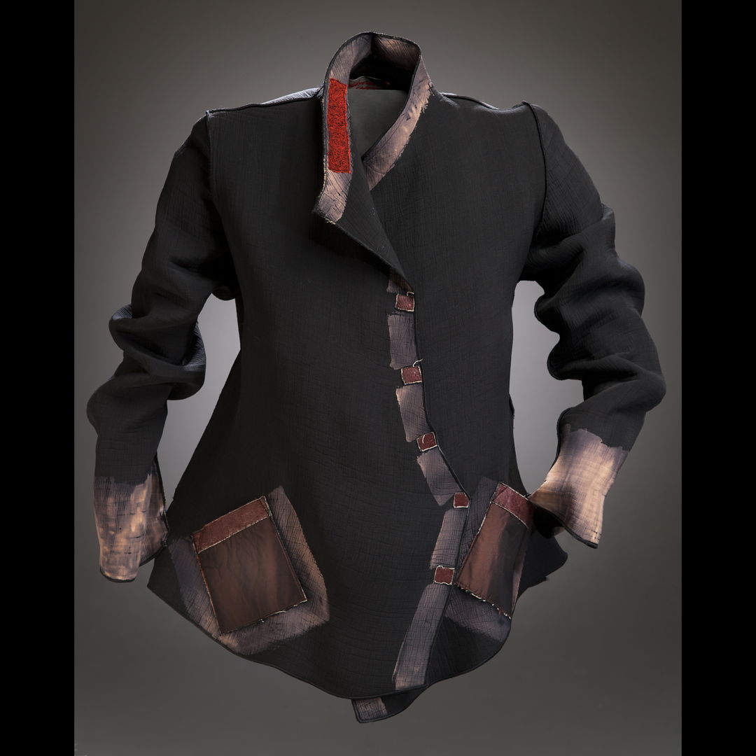 black silk with color removal trim. Applique at collar