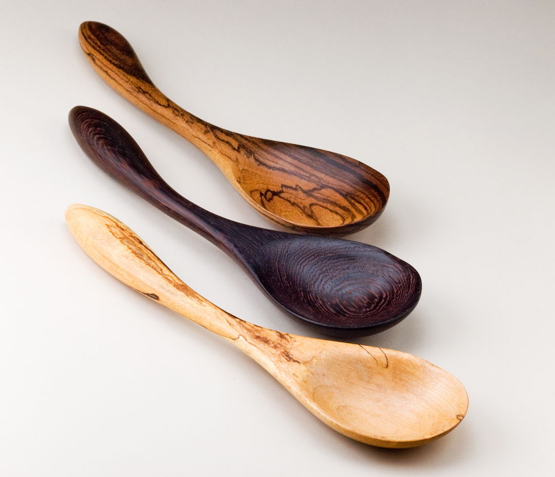Hand-carved  hand-sanded Serving Spoons in (top to bottom) Zebrawood  Wenge  and Spalted Birdseye Maple. These are not only decorative  but functional and durable. Sold individually.