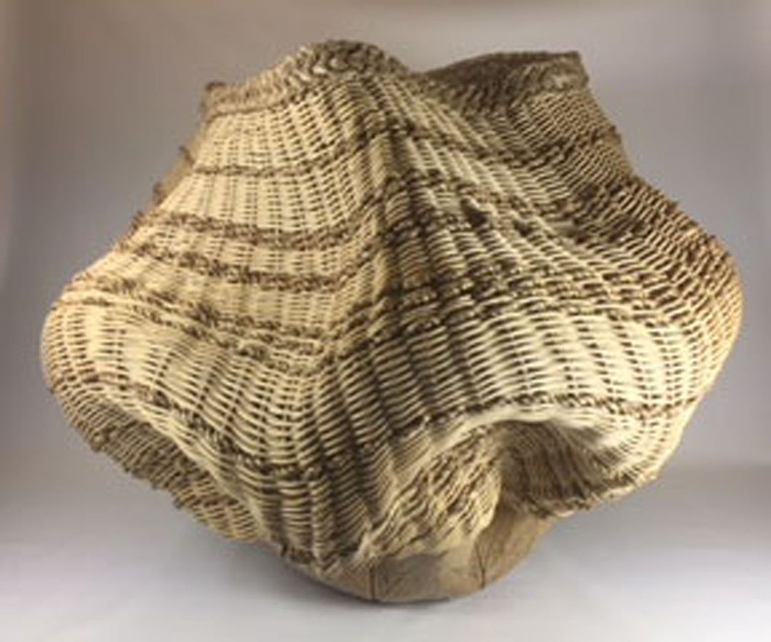 Leaf imprints on a stoneware base then woven with natural and smoked reed with twisted seagrass and a braided seagrass rim.