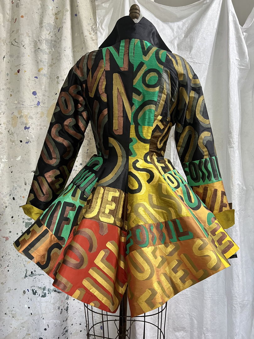 Hand painted verbiage on over 40 separated pieces  then joined (stitched) together like the pieces of a puzzle. The fabric is very silks. The piece is lined and fully finished by the artist.