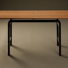 One-of-a-kind console table. Quartersawn and bookmatched American sycamore floats above an ebonized beech base on 10 anodized aluminum posts. Trios and singles of aluminum tubes  spaced in the same arrangement as in the table top  connect the front and back frames of the base.
