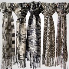 Five patterns  in black and white  like a garden in winter exhibit all structure  no color. This shows a nice range in terms of pattern. 100% Silk.