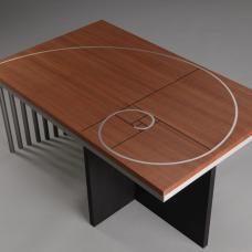 The Greek letter Phi represents the golden rectangle ratio of length to width  used here to proportion the Phi coffee table. Inlaid aluminum spiral and black grooves in a solid makore top. Ebonized ash and aluminum base. Limited edition of 8
