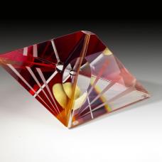 Optical glass that has been cold-worked: a centuries old Bohemian technique using no heat  but rather room temperature glass is shaped using water and abrasives in conjunction with lapidary tools. The techniques involved are cutting  grinding  polishing  laminating and coloring.