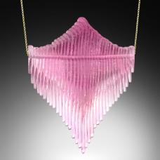 Digitally designed  waterjet cut glass  coldworked  polished  and locked onto an sterling silver inner tube that maintains the movement of the 33 individual pieces of glass when threaded onto its gold fill chain. 