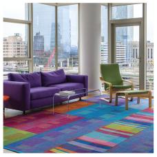 Contemporary rag rug handwoven in 100% cotton yarn and fabric strips using the traditional Log Cabin Weave technique