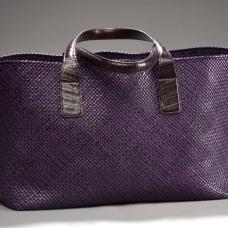 This purple tote was handcrafted from natural veg-tanned goatskin leather strips that were individually hand-cut  edge-thinned  edge-dyed  and folded into 3/16-inch wide strips then woven the traditional way using basic weaving pattern. Provided with natural veg-tanned alligator leather handles.