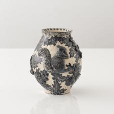 Materials: white stoneware  slip  glazes Techniques: handbuilt with sgraffito decoration