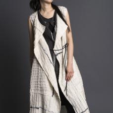 Hand-dyed shibori using sustainable dyes and linen. Deconstructed  pieced  stitched. Hand-patterned. Constructed with couture finishing by hand and machine. Worn with Cocoon Jinbaori.