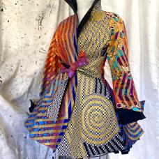 Every inch of fabric is hand painted with graphics done with a 3/8&amp;quot; brush. The results are mesmerizing on both solid and woven pattern fabrics. Each piece is carefully planned out for placement is everything. After painting  all panels are assembled and finished by the artist.