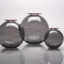 Three sizes of mezza filligrani cane with red lip wrap.