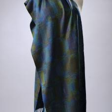 Polyvalence is a weaving technique that allows for large patterns without sacrificing good fabric structure. The pattern is scattered into twills and rearranged twills. The technique originated in France.This shawl is woven in olive on a warp of hand-dyed colors of the ocean