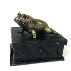 Leather sculpture frog on top of suede lined leather “treasure” box with eyes.