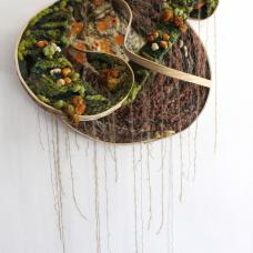 Interdependence is the reliance of two or more things on one another. In this piece the botanically dyed cloth is moving in to the woven areas  further integrating itself into the system. There background is hand stitched  and amalgamation of prints from various plants coming together to create a visual field in conversation with the woven planes. The bent wood frame is highlighted as a visual element in addition to framing and supporting the piece.