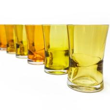 Low tide flight glasses with thick optic base and pinched waist form. Perfect for juice or a flight sampler. 7oz pictured in 3 separate colors creating a sunset set.