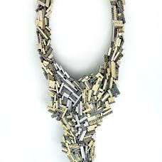 This one of a kind art piece is assembled hundreds of small leather pieces like a wild mosaic. Like a crazy quilt  once you start  you never really know how the piece will look like when it is finished. All small pieces are set on a soft leather backing. The closure is a hidden magnet clasp.