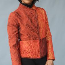 Pieced jacket of iridescent  orange  textured silk with coordinating bias  collar and matching handmade buttons.