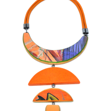 handcut Durat (post-cusumer countertop) and upcycled skateboards with hand-fabricated sterling silver components and leather cord