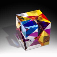 Optical glass that has been cold-worked: a centuries old Bohemian technique using no heat  but rather room temperature glass is shaped using water and abrasives in conjunction with lapidary tools. The techniques involved are cutting  grinding  polishing  laminating and coloring.