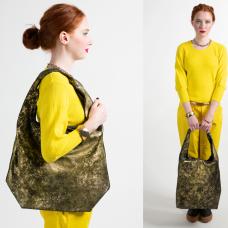 model with leather shoulder bag