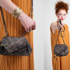 model holding leather bag