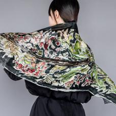 the back of a shawl with floral watercolor pattern