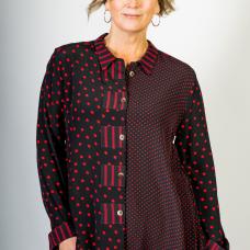 model with asymmetric shirt with polka dots and stripes