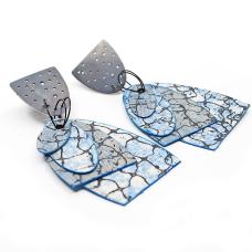 Earrings made of washable paper (cellulose + synthetic latex) printed on an etching press with soy-based archival inks; and oxidized sterling silver. These earrings have sterling silver posts and ear nuts.