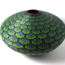 Turned and hollowed Maple vessel embellished with pyrography and hand-dyed with archival ink to give the appearance of a woven basket.