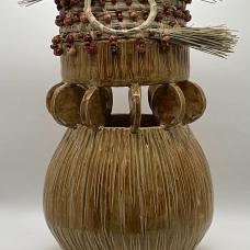 Wheel thrown vessel thrown in two parts  whereby connecting both parts with ceramic circles with precision. South Carolina coastal sweetgrass attached wooden beads to highlight both art forms