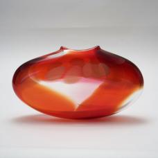 Blown glass form with two complimentary color wraps that float over clear glass windows  and a simple murrini dot pattern on each side.