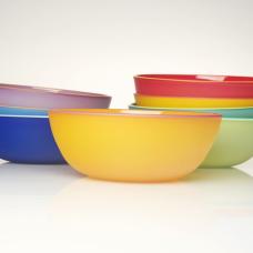 Blown glass vessels made from opaque colored glass with contrasting colored glass lip wraps. Etched on the outside.
