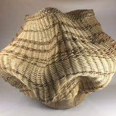 Leaf imprints on a stoneware base then woven with natural and smoked reed with twisted seagrass and a braided seagrass rim.