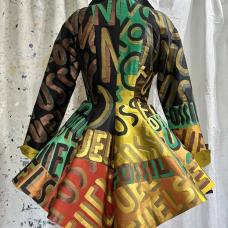 Hand painted verbiage on over 40 separated pieces  then joined (stitched) together like the pieces of a puzzle. The fabric is very silks. The piece is lined and fully finished by the artist.