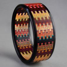 Linear Mosaic Bracelet made with the natural colors and grains of 12 different specie of wood and artist hand dyed veneers. Ebony edges  Brillant series  comprised of 400 individual pieces of wood.
